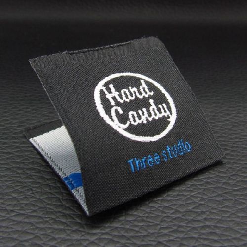 Polished Die Cutting Woven Label, Feature : High Quality, High Tensile