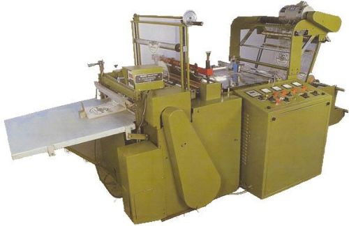 AUTOMATIC BOTTOM CUTTING AND SEALING MACHINE