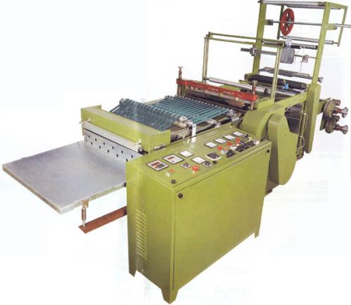 AUTOMATIC SIDE SEALING AND CUTTING MACHINE