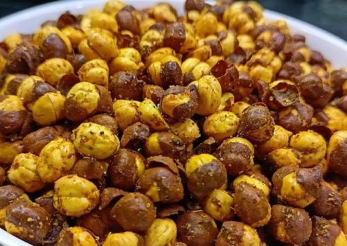 Brownish Roasted Skinned Masala Chana, For Human Consumption, Taste : Spicy