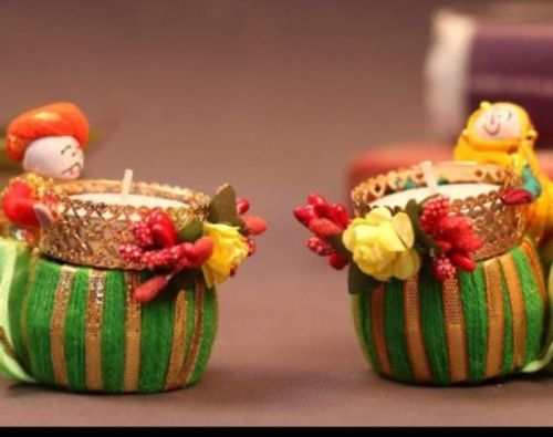 Multicoloured Round China Clay Decorative Puppet Diya, For Decoration Use, Feature : Effective, Moisture Proof