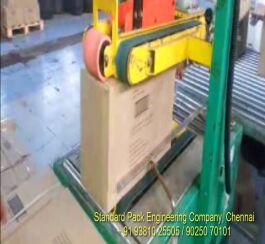 CARTON BOX TAPPING MACHINE