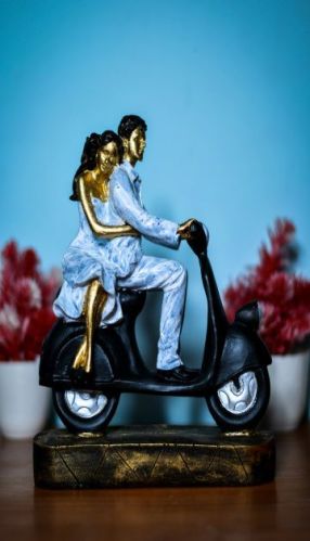 Polyresin Scooter Love Couple Statue, For Interior Decor, Speciality : Attractive Look