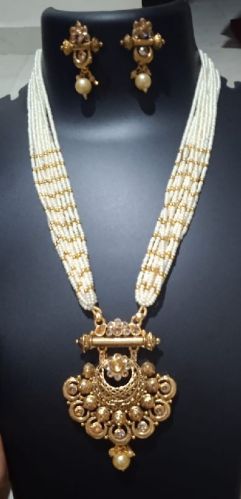 Ten Layered White Beads Golden Earrings Pendant Necklace Set