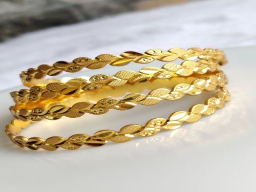 Regular Wear Golden Artificial Bangles, Feature : Shiny Look, Rust Proof