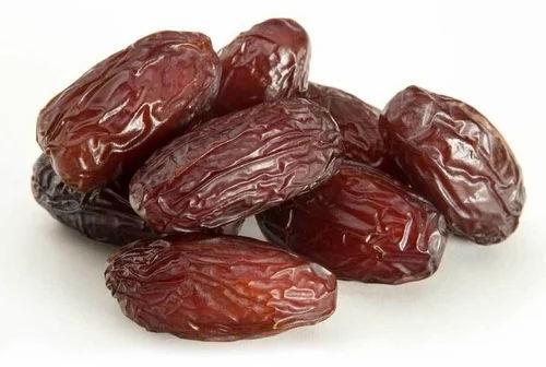 Brown Oval Arabian Dates, For Sweets, Packaging Size : 20 Kg