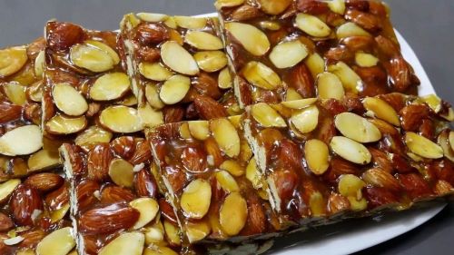 Natural Sugarcane Jaggery Almond Chikki, Color : Brownish