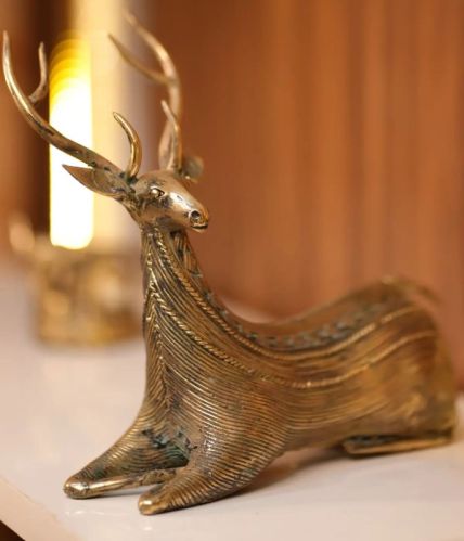 Bell Metal Sitting Deer Figurine, For Home Decor, Gifting, Packaging Type : Cartoon Box