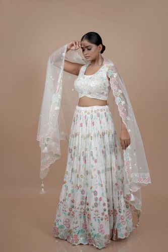 Ladies White Embroidery Work Lehenga Choli, Technics : Machine Made