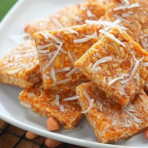 Natural Peanut Coconut Chikki, Packaging Size : 250 Grams, 500 Grams, Packaging Type : Plastic Packet