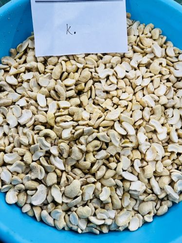 K Grade Split Cashew Nuts, Taste : Light Sweet For Human Consumption