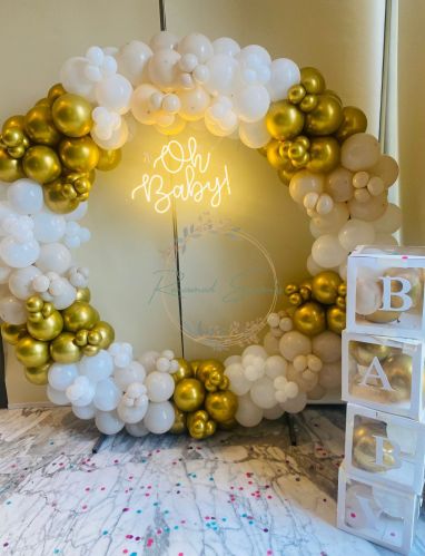 Stylish And Memorable Baby Shower With Baby Boxes And A Neon Light