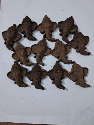 Carved Pure Cow Dung Ganesha Mukh, Color : Brownish