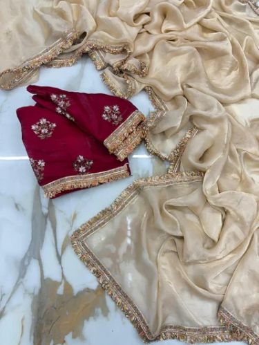 Dark Ivory Shimmery Tissue Saree With Pretty Lace Work