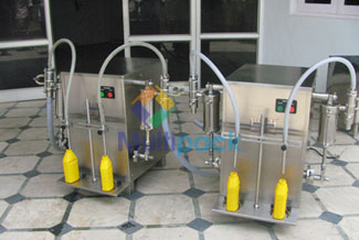 Two Head Semi Automatic Volumetric Liquid Filling Machine