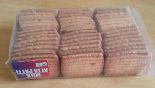 Milk Atta Biscuits, For Snacks, Packaging Type : Paper Box, Plastic Packet