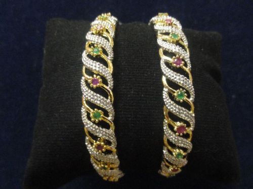 Polished Studded Metal Artificial Bangles, Packaging Type : Velvet Box, Plastic Packet