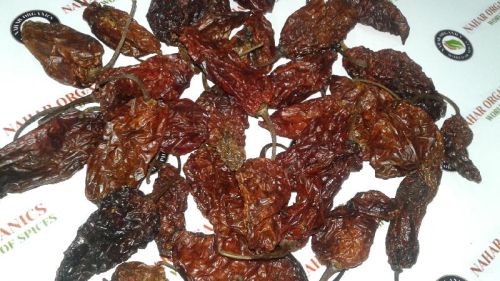 Oval Organic Smoke Dried Bhut Jolokia, Packaging Type : Plastic Bags