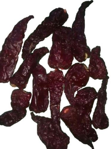 Organic Stemless Kashmiri Dabbi Chilli, Color : Dark Red