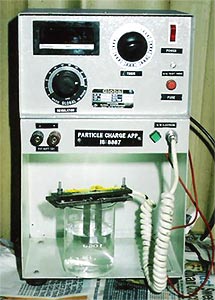 PARTICLE CHARGE APPARATUS