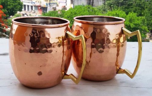 COPPER MUG WITH BRASS HANDLE HAMMERED DESIGN..