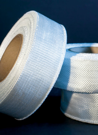 WOVEN KNITTED COMPOSITE REINFORCEMENT TAPES