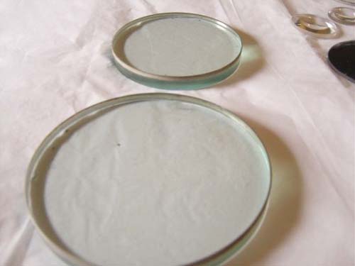 Round Glass Hand Corrected Optics, For Laser Applications, Feature : High Clarity, Perfect Finishing